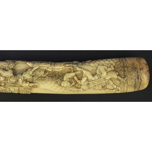 623 - Oriental carved bone dagger profusely carved with robed figures climbing a tree, 27.5cm long