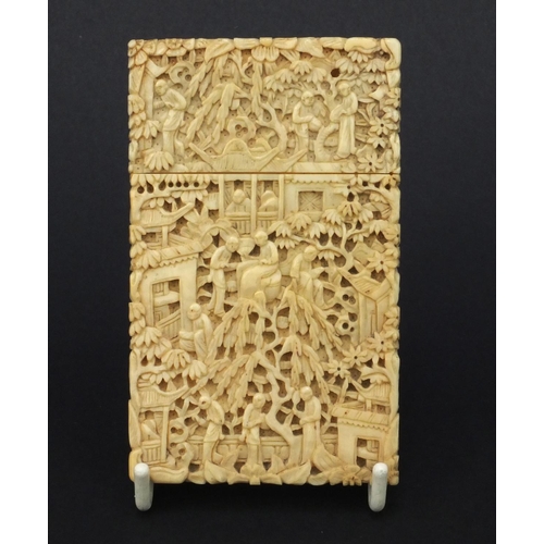 617 - Oriental Chinese Canton ivory card case profusely carved with seated figures, trees and bridges, 9.5... 