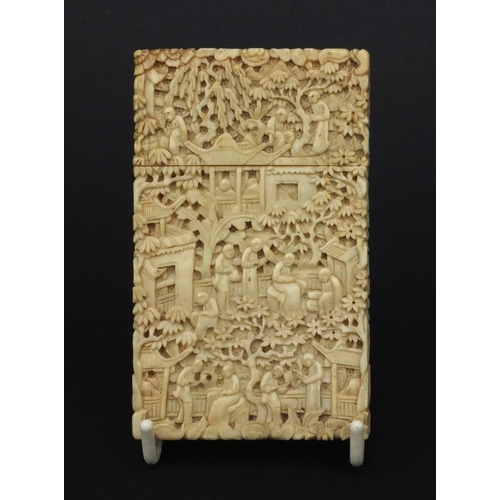 617 - Oriental Chinese Canton ivory card case profusely carved with seated figures, trees and bridges, 9.5... 