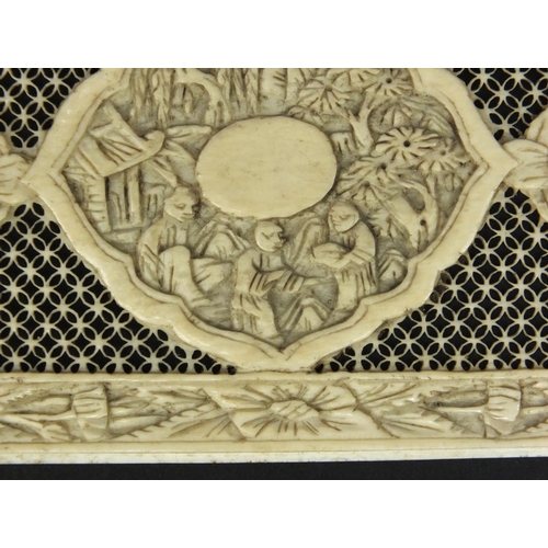 620 - Oriental ivory panel with pierced decoration, the border and central field carved with flowers and f... 