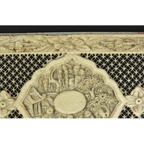 620 - Oriental ivory panel with pierced decoration, the border and central field carved with flowers and f... 