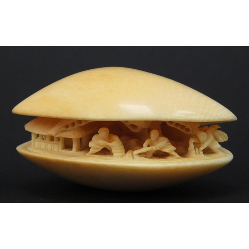 613 - Oriental carved ivory clam shell and an oriental carved ivory Netsuke, both with character marks to ... 