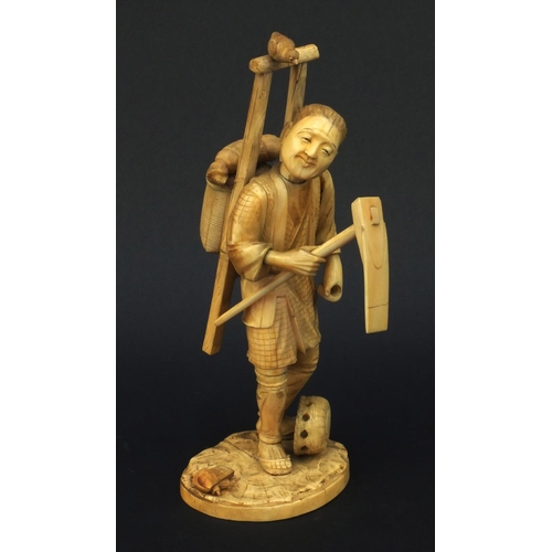 601 - Oriental ivory okimono of a peasant carrying a basket and tools, 23cm high