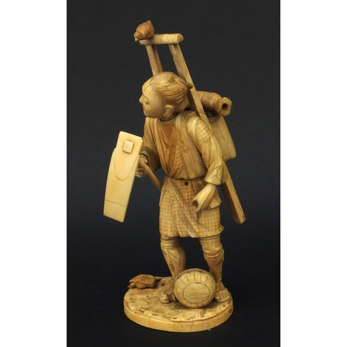 601 - Oriental ivory okimono of a peasant carrying a basket and tools, 23cm high