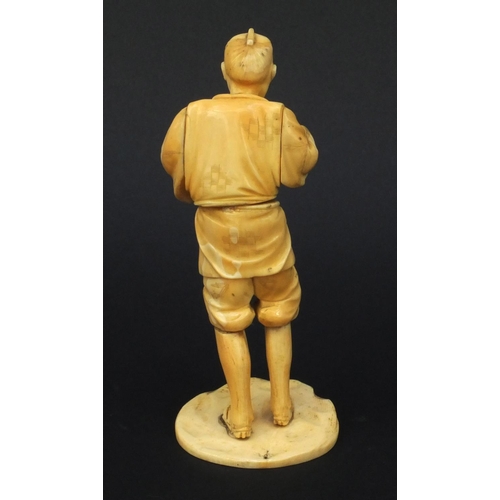 609 - Oriental Japanese carved ivory okimono of a tradesman, red seal mark to base, 15cms high