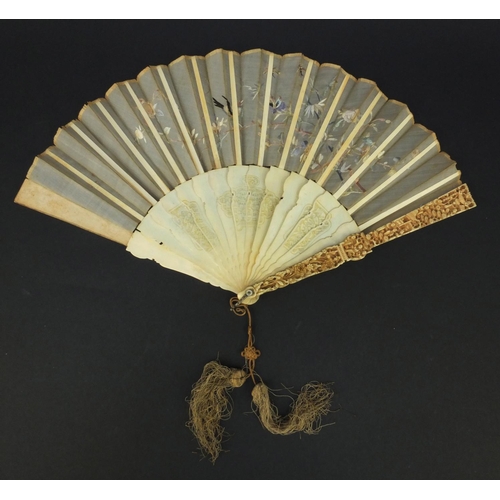 616 - Oriental Chinese Canton ivory fan carved with figures and flowers, the silk embroidered with birds a... 