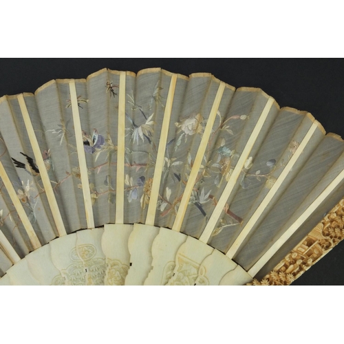 616 - Oriental Chinese Canton ivory fan carved with figures and flowers, the silk embroidered with birds a... 