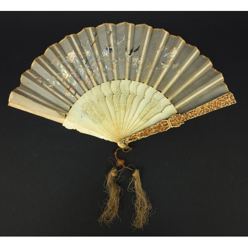 616 - Oriental Chinese Canton ivory fan carved with figures and flowers, the silk embroidered with birds a... 