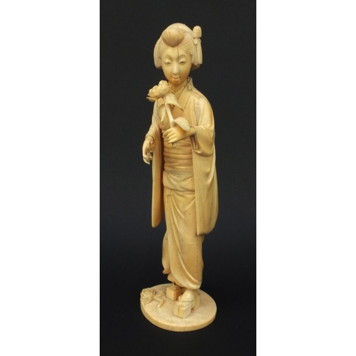 600 - Oriental Japanese carved ivory okimono of a geisha girl, red character mark to base, 30cm high