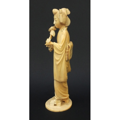 600 - Oriental Japanese carved ivory okimono of a geisha girl, red character mark to base, 30cm high