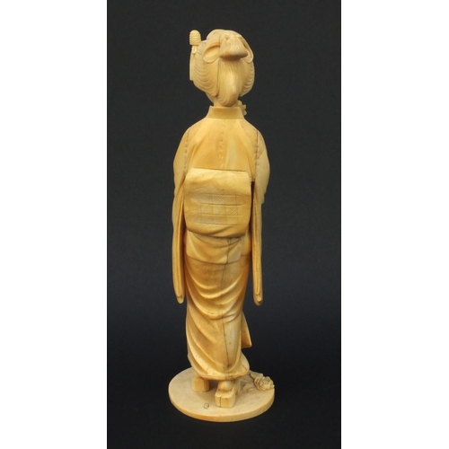 600 - Oriental Japanese carved ivory okimono of a geisha girl, red character mark to base, 30cm high