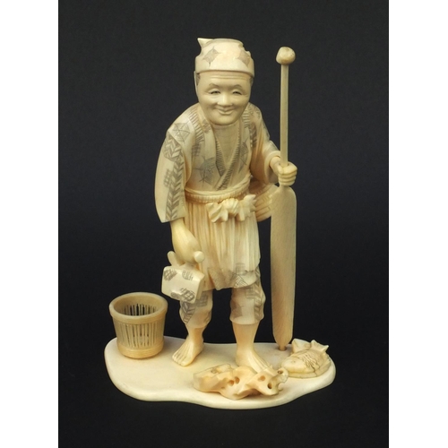 602 - Oriental carved ivory okimono of a fisherman, signature to base, 19cm