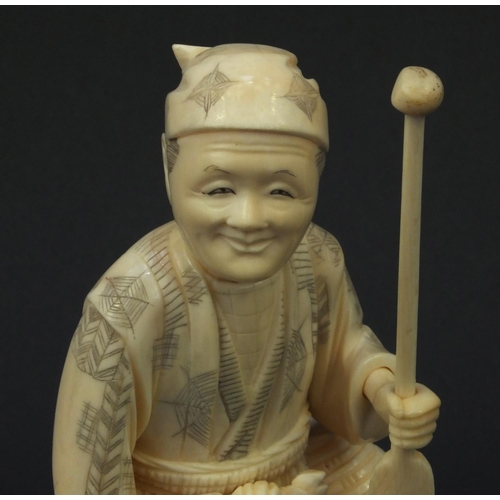 602 - Oriental carved ivory okimono of a fisherman, signature to base, 19cm