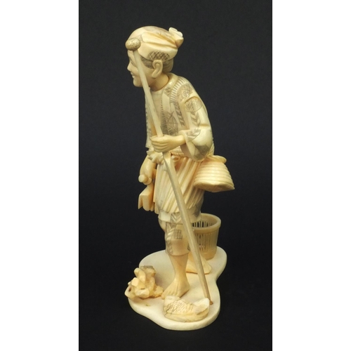 602 - Oriental carved ivory okimono of a fisherman, signature to base, 19cm