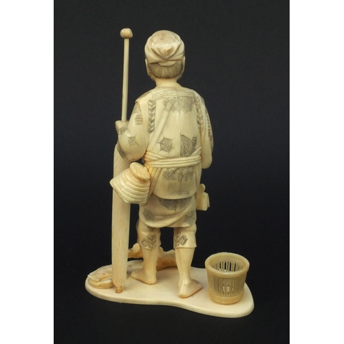 602 - Oriental carved ivory okimono of a fisherman, signature to base, 19cm