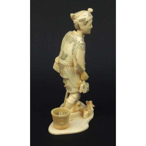 602 - Oriental carved ivory okimono of a fisherman, signature to base, 19cm