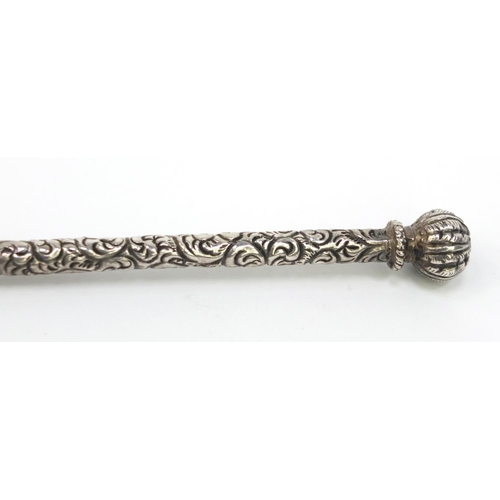130 - Unmarked silver floral chased dip pen, 18cm long