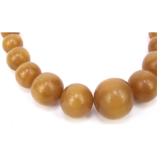 630 - Oriental Chinese rhino horn beaded necklace, the largest bead 2.5cm diameter