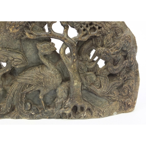 643 - Large oriental carved soapstone group of dragons and birds amongst trees, 39cm wide