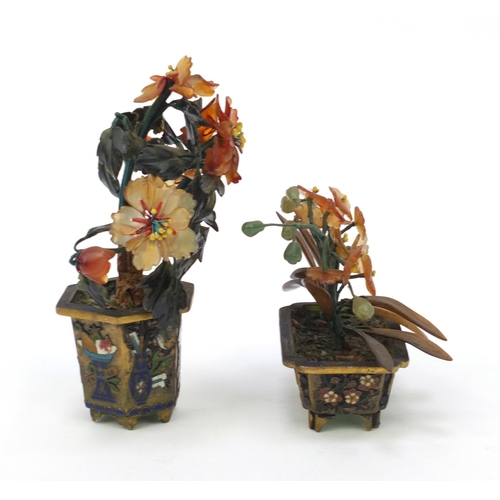 680 - Two oriental Chinese enamel pots with hard stone flowers mounted on a wooden stand, the stand 18cm w... 