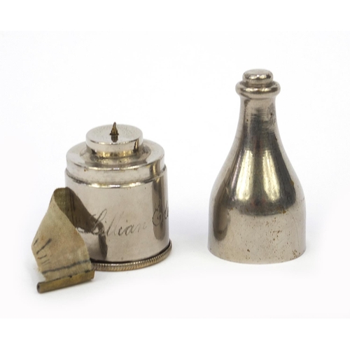 101 - Sewing interest tape measure and thimble holder in the form of a wine bottle, 7cm high