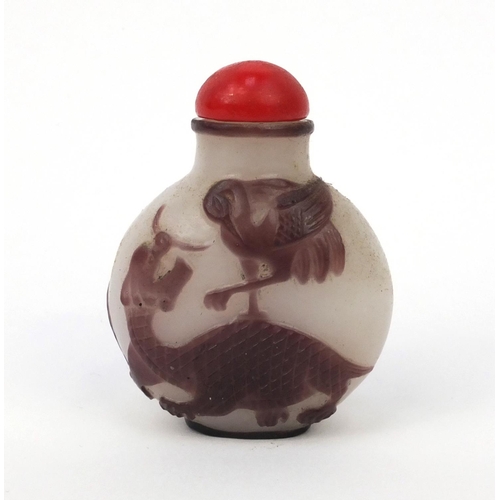 645 - Oriental Chinese cameo glass snuff bottle decorated with winged horses, 7cm high