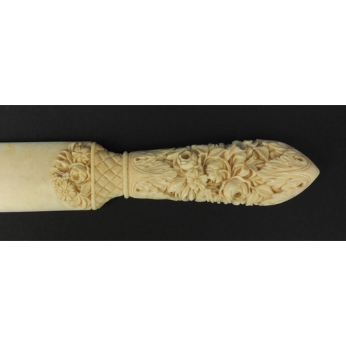 139 - Floral carved ivory letter opener, 24cm wide