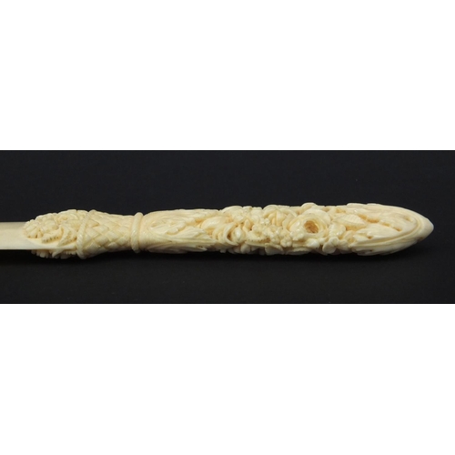 139 - Floral carved ivory letter opener, 24cm wide