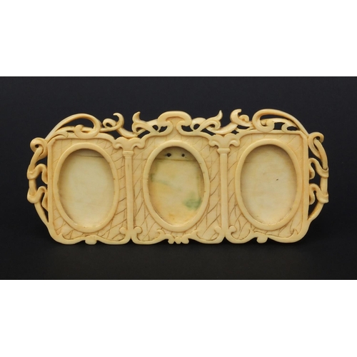 8 - Ivory triple pierced and carved photo frame, 15cm wide