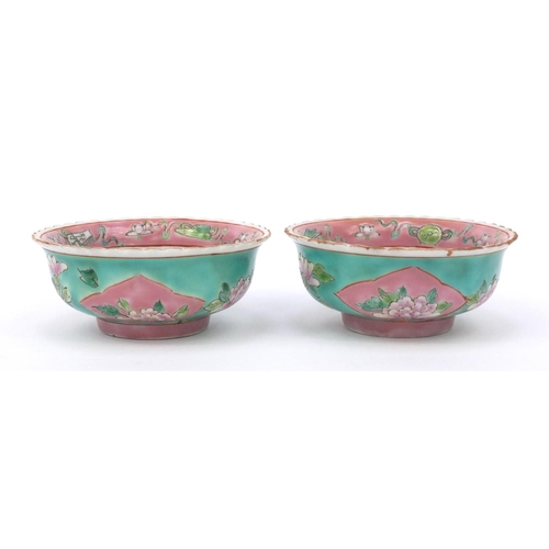 580 - Two oriental Chinese porcelain bowls hand painted with flowers, character mark to base, each 11cm di... 