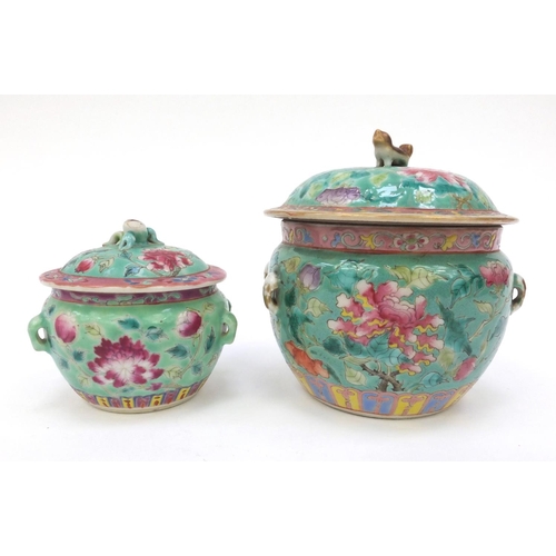 577 - Oriental pot and cover hand painted with floral design with dog of Foo lid, together with a similar ... 