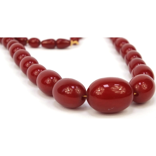 1171 - Cherry amber coloured bead necklace, 70cm long, approximate weight 72.2g