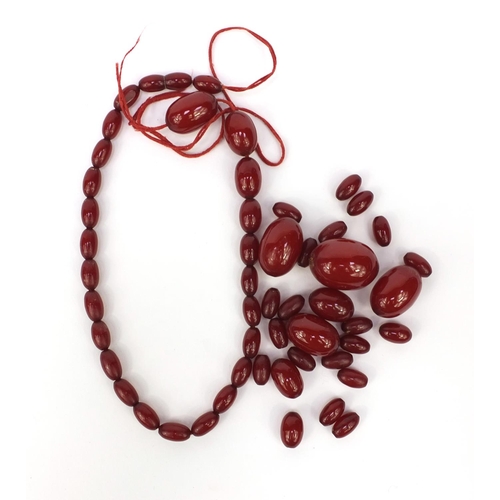 1172 - Cherry amber coloured bead necklace, approximately 70cm long, approximate weight 59.5g
