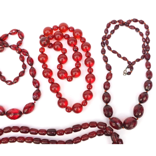 1173 - Five cherry amber coloured bead necklaces, approximate weight 472.5g