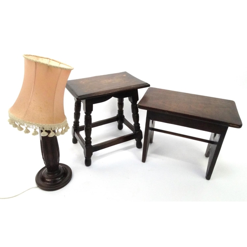 61 - Oak joynt stool and one other wooden stool, together with a carved mahogany table lamp