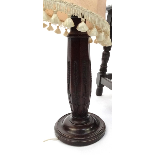 61 - Oak joynt stool and one other wooden stool, together with a carved mahogany table lamp