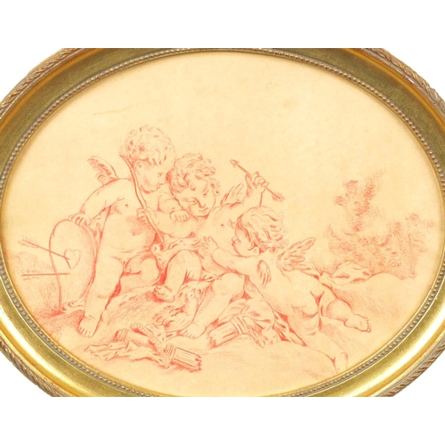 1328 - Pair of oval crayon drawings of putti, bearing a signature L. Brulin, both gilt framed, each 24cm x ... 