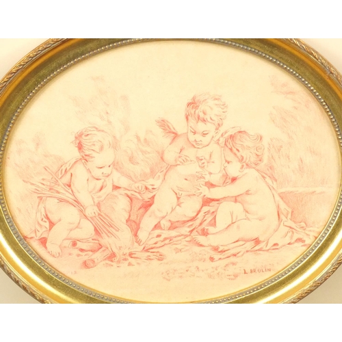 1328 - Pair of oval crayon drawings of putti, bearing a signature L. Brulin, both gilt framed, each 24cm x ... 