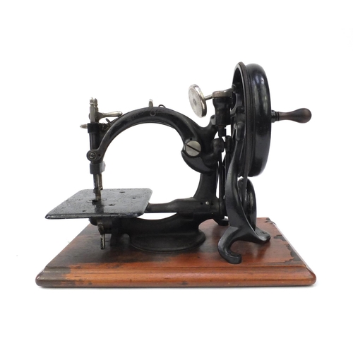 93 - Victorian Wilcox & Gibbs chain stitch sewing machine numbered A35441, together with a fitted case, t... 