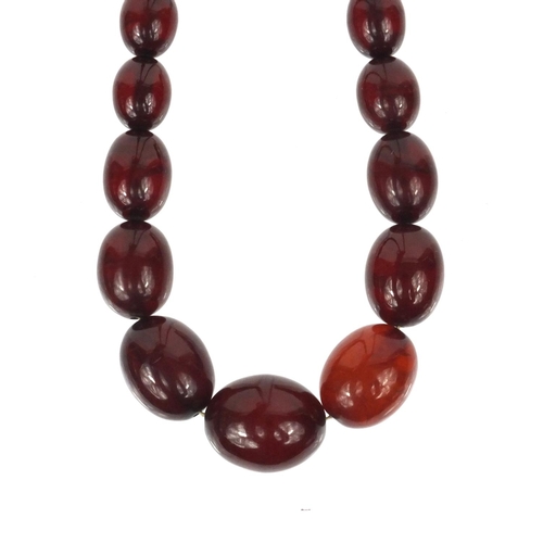 1169 - Cherry amber coloured bead necklace, 80cm long, approximate weight 101.0g