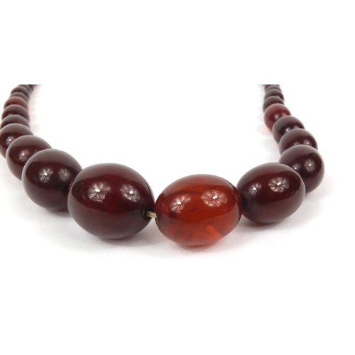 1169 - Cherry amber coloured bead necklace, 80cm long, approximate weight 101.0g