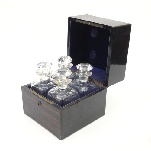 21 - Good quality Victorian coromandel decanter box with Brahmer lock, housing four cut glass decanters, ... 