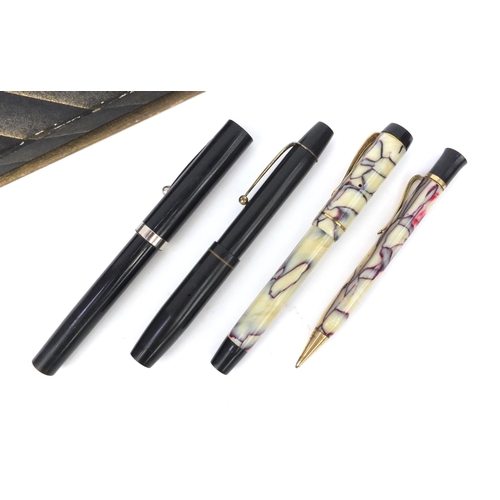 138 - Boxed marbleised propelling fountain pen and pencil set, together with a Shaeffer and one other foun... 