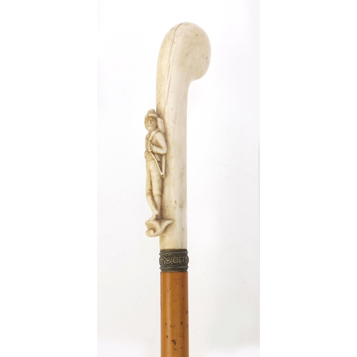 64 - Malacca walking cane with ivory handle carved as a huntsman, 82cm long