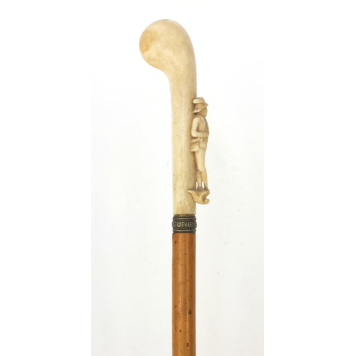 64 - Malacca walking cane with ivory handle carved as a huntsman, 82cm long