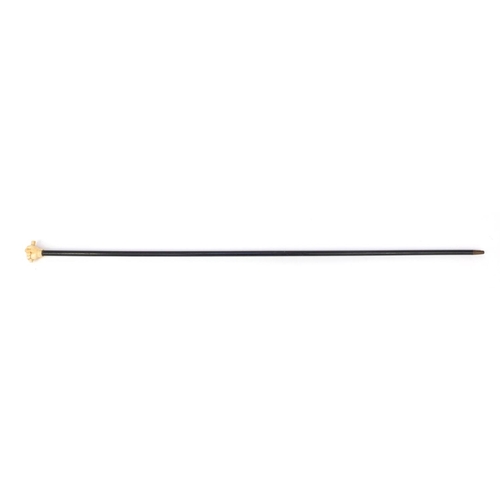 66 - Ebonised walking stick with ivory pommel carved as a clenched fist, 90cm long