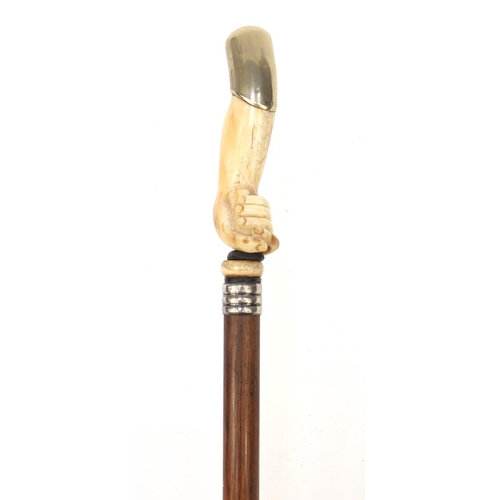 65 - Rosewood walking stick with ivory handle modelled as a clenched fist with silver plated top, 92cm lo... 