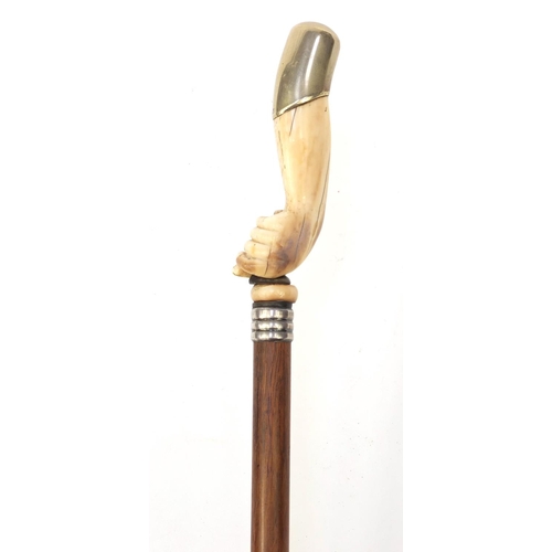 65 - Rosewood walking stick with ivory handle modelled as a clenched fist with silver plated top, 92cm lo... 