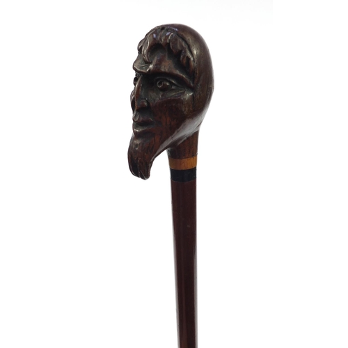 75 - Mahogany walking cane with carved bearded gentleman's head top, 90cm long