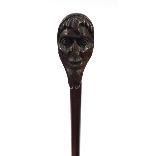 75 - Mahogany walking cane with carved bearded gentleman's head top, 90cm long